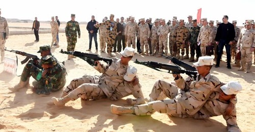 Some of the Egyptian soldiers assigned to the African Union mission demonstrate a casualty evacuation technique.