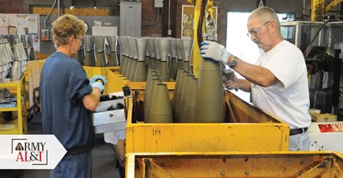 Workers at the Iowa Army Ammunition Plant prepare 155 mm artillery rounds to be filled as a part of the load, assemble, and pack operation.