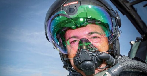 A BAE Systems test pilot models the Striker II HMD for the Eurofighter. Originally a UK project among the Eurofighter partner nations, the Striker II will not be fielded also by Germany and Italy, with Spain yet to formally declare its intent.