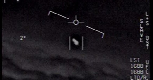 A screenshot of sensor footage from a US Navy F/A-18 Hornet showing a UAP. The UK government has said that 50 years of investigations into UAPs have shown them not to be a military threat to the country.