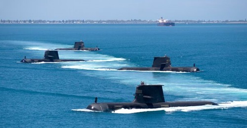 Four Collins-class submarines are pictured in formation as they transit through Cockburn Sound on the coast of Western Australia. The last Collins-class boat is scheduled to be operated by the RAN into the early 2040s.