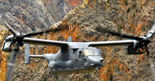 An AFSOC CV-22 Osprey flies over the New Mexico/Colorado wilderness. All V-22s with low-time proprotor gearboxes must undergo inspections to return to flight.