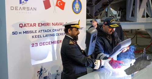 Major General Abdullah Hassan Al Sulaiti, commander of the Qatar Emiri Naval Forces, making the first ceremonial welding of the QENF's two 50 m missile attack craft.