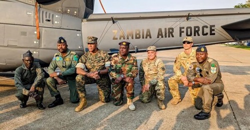 US and Zambian air force officials pose in front of one of four Bell 412EP helicopters acquired by the African country in 2023. Further helicopters (believed to be five) have now also been approved.