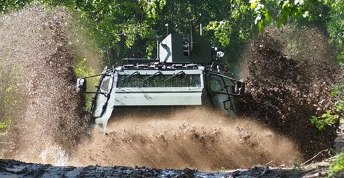The Patria 6×6 vehicle seen traversing the forest terrains typical in many of the countries of the CAVS programme.