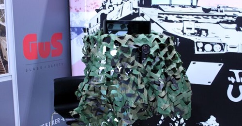 The system combines a digital image feed with a conventional optic device.