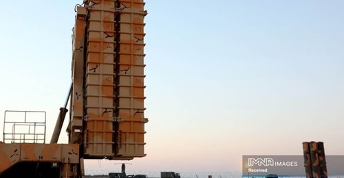 An S-300 launcher and a 64N6E2 radar are seen behind the Bavar-373 TELAR during the air-defence exercise.