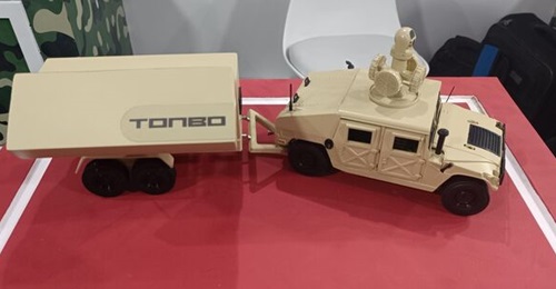 A model of Tonbo's WaveStrike high-power microwave directed energy weapon system displayed at the Aero India 2025 show in Bangalore.