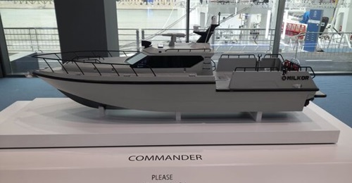 A scale model of Milkor UAE's Commander high-speed patrol craft on display at NAVDEX 2025.