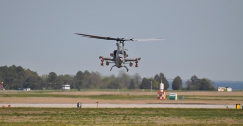 A US Marine Corps AH-1Z with a Long Range Precision Fires munition mounted to the outer weapons station of both stub wings. Little is publicly known about the munition, which is likely capable of performing both kinetic and non-kinetic roles.