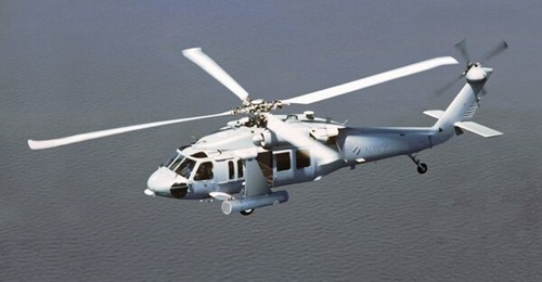 The cylindrical AN/AES-1 ALMDS seen mounted on an MH-60S Seahawk helicopter.