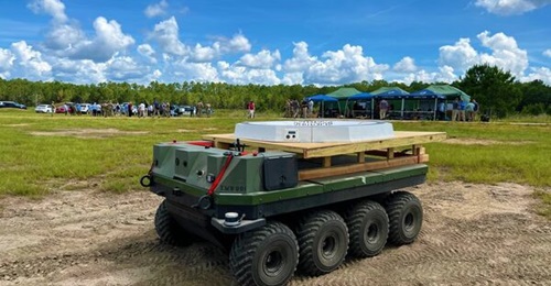 An autonomous Small Multipurpose Equipment Transport (S-MET) with a small unmanned aircraft system landing pad is demonstrated with the Close Combat Lethality Task Force.