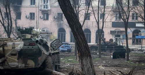 Destroyed armour left on 15 April 2022 after fierce street fighting on Victory Road in the Ukrainian city of Mariupol.