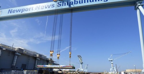 A manifold made with additive manufacturing was used in the construction of aircraft carrier 
        
        , shown here at keel-laying at Newport News Shipbuilding.