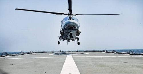 A helicopter landing on the flight deck of BNS 
        
        for the first time.