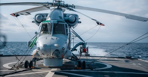An RNZN Kaman Seasprite SH-2G(I), equipped with a Kongsberg Penguin 2 Mod 7 anti-ship guided missile on its portside wing, is parked on the deck of HMNZS 
        
        .