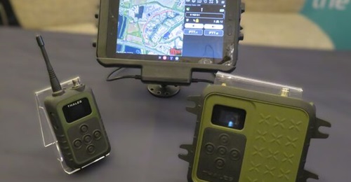 The Thales Vehicle Mounted SquadNet Radio (right) with the handheld version (left) and a display running the ATAK tactical awareness application displayed in March 2025 at the Future Soldier Technology Conference in London.