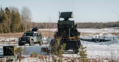 The Swedish Armed Forces' Loke C-UAS, with a detector and effector mounted on separate vehicles, seen at Enköping test area in March 2025.