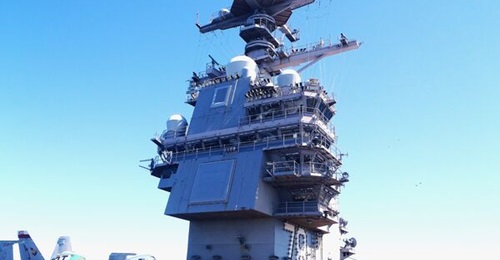 USS 
        
        , pictured here during COMPTUEX, is being prepared for deployment.