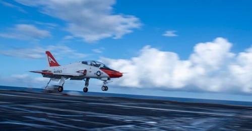 A T-45C Goshawk lands on the USS
        
         (CVN 69) in 2024. The aircraft that replaces the T-45C will not need to land on aircraft carriers, or even land a carrier-style approach.