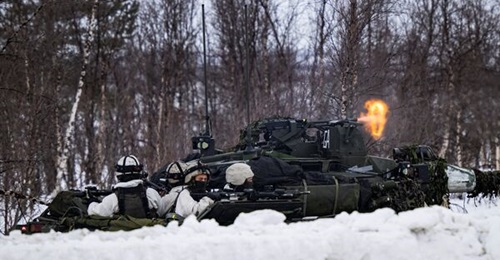 Soldiers with a CV90 infantry fighting vehicle take part in the NATO 'Nordic Response 24' military exercise on 9 March 2024 on the Norwegian side of the Kivilompolo border crossing between Finland and Norway.