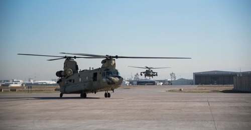 US Army CH-47 Chinook (foregound) and UH-60 Black Hawk helicopters at Erbil Air Base on 27 February 2025.
