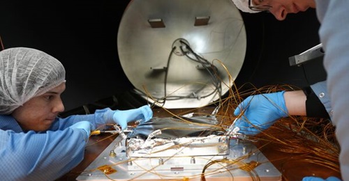 QuantX personnel conducting environmental testing on the optical frequency comb, which is a key optical atomic clock technology that will be launched into space for testing.