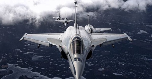 French Rafales, including nuclear-capable aircraft, exercising with Swedish Gripens during Exercise 'Pégase 25'.