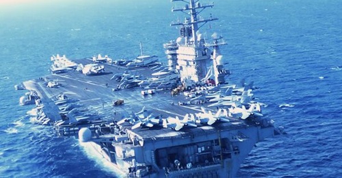 The carrier strike group anchored by aircraft carrier USS 
        
         shown here operating in the Red Sea in June 2024, thwarted Houthi missile and drone attacks.