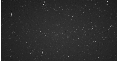 Image taken by the LOCI network, showing satellite streaks across the field-of-view against the background star field.