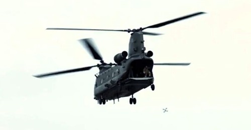 A first-person-view drone is seen being deployed from the rear ramp of a Chinook helicopter during Hornets Nest trials conducted by the RAF.