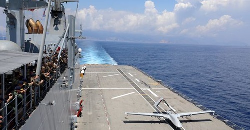 A Baykar TB3 UCAV lands on TCG 
        
        after finishing its sortie.