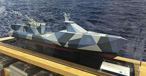 A model of the combat USV being developed by Japan's ATLA in partnership with Mitsubishi Heavy Industries displayed at the DSEI Japan 2025 show being held in Chiba.