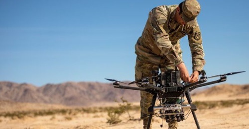 A US Army captain assigned to the Artificial Intelligence Integration Center conducts field testing at Fort Irwin, California.