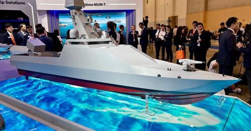 A model of the Combat Unmanned Surface Vessel concept on display at MADEX 2025.