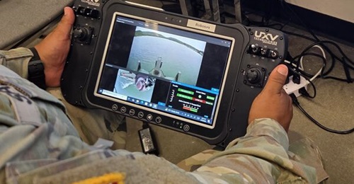 The tablet controller, which was connected to the MANET network for the MSPIX 25 Remote and Autonomous Control for Bridging and Rafting experiment, showing two video streams from the M30 Bridge Erection Boat.