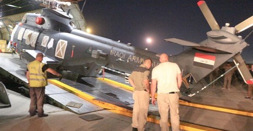 One of the first batch of newbuild Caracal helicopters for Iraq being offloaded from an An-124 strategic transport aircraft.