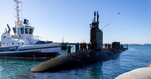 US attack submarine USS 
        
         (pictured here) calls at an Australian port shortly after the AUKUS deal is reached. The joint submarine programme is now under Pentagon review.