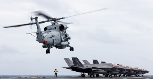 A Royal New Zealand Navy SH-2G(I) Seasprite Helicopter from HMNZNS 
        
        lands onboard HMS 
        
        .