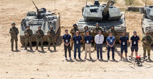 EID representatives at ARTEX 2025 where TICS was demonstrated with a Pandur ll 8×8 and M577 APC.