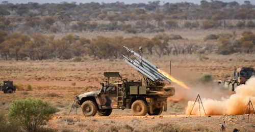 An Australian Army Hawkei launcher fires an AIM-9 Sidewinder during a recent certification activity at the Woomera Test Range.
