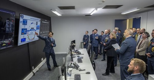 New Zealand's Defence Minister Judith Collins attends a briefing with senior New Zealand Defence Force officers during a ceremony marking the establishment of a space unit at RNZAF Base Auckland.