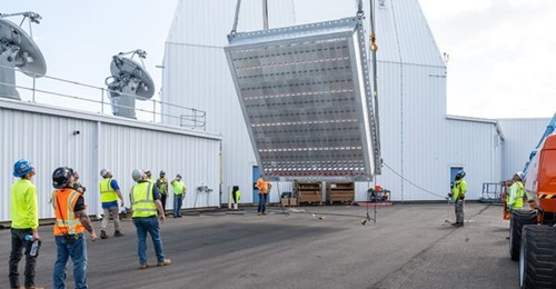 An AN/SPY-7(V)1 radar antenna being hoisted into position at Lockheed Martin's Production Test Center in Moorestown, New Jersey.