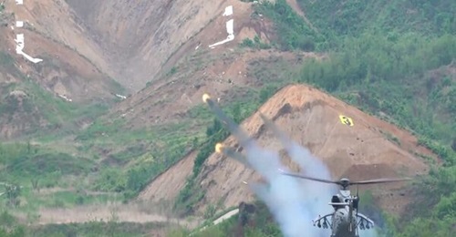 A KAI Marine Attack Helicopter launches rockets during a live-fire test in 2025.