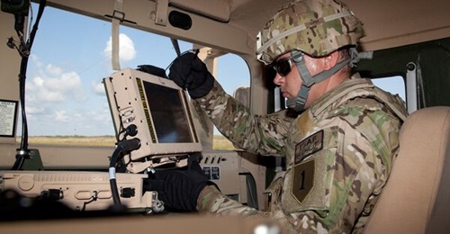A US soldier uses a Leonardo DRS Mounted Family of Computer Systems battle management system. The company sees a growing market internationally for its battle management systems.