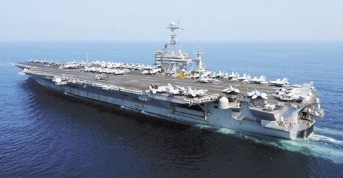 Aircraft carrier USS 
        
        , pictured here operating in the Arabian Sea, is undergoing an overhaul.