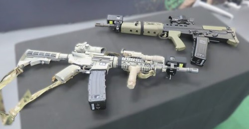 Replicas of Airsoft SA80 and M4 rifles fitted with Bagira's RTES kit displayed at DSET 2025.