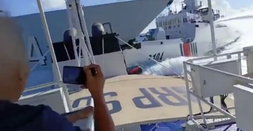 A screenshot from a video released by the Philippine Coast Guard showing a collision between the two Chinese vessels.