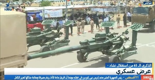 A still from Chadian television coverage of the anniversary parade showing two Norinco AH4 towed howitzers with the Rapid Intervention Force (FIR) contingent.