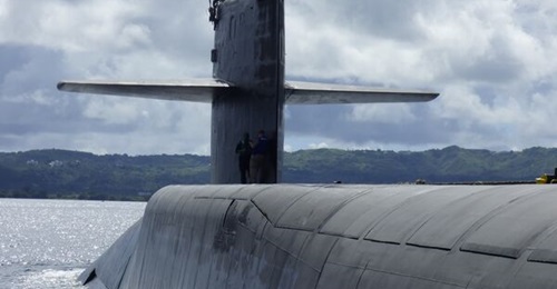 The US expects more contested operations for guided missile submarines such as USS 
        
        , shown here operating off the coast of Guam.